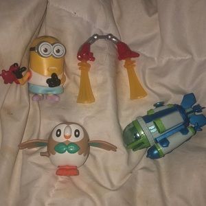 4 various small children figurine toys